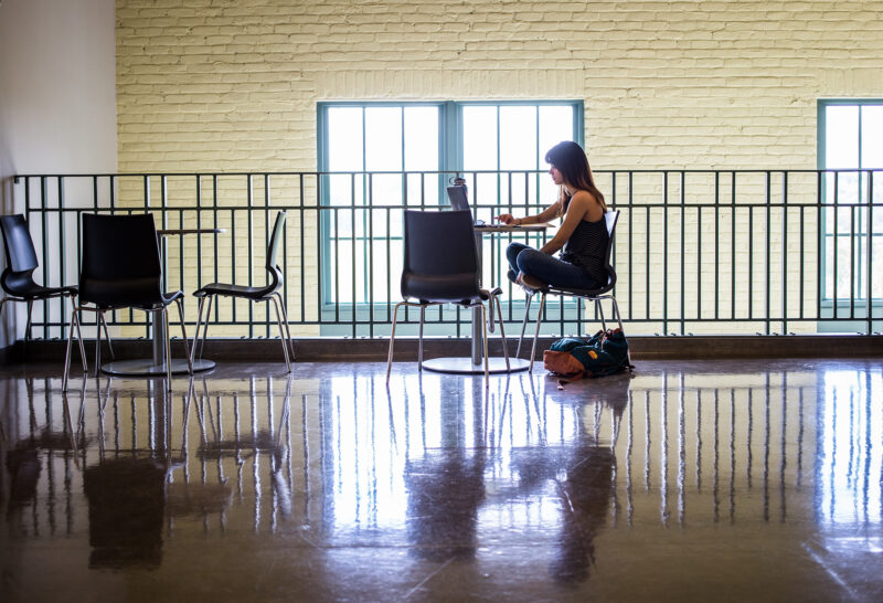 A student in the public space at RGC building 3000