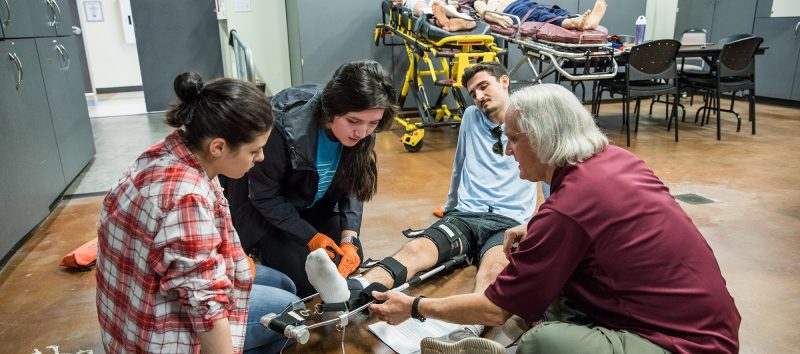 students practing in the EMT lab